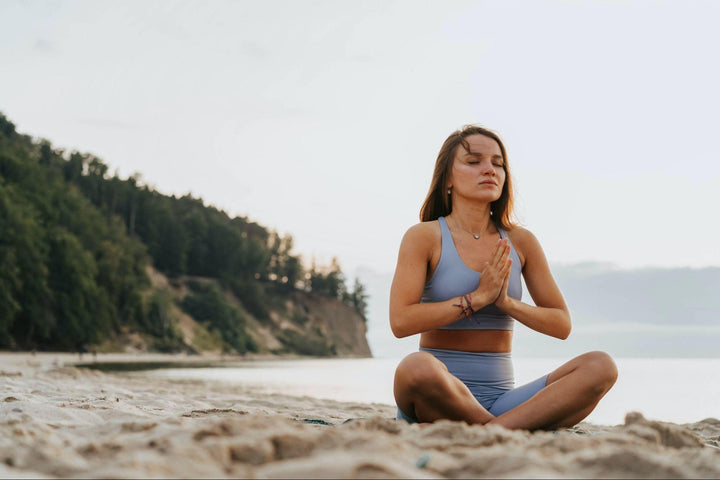 an athletic woman meditating